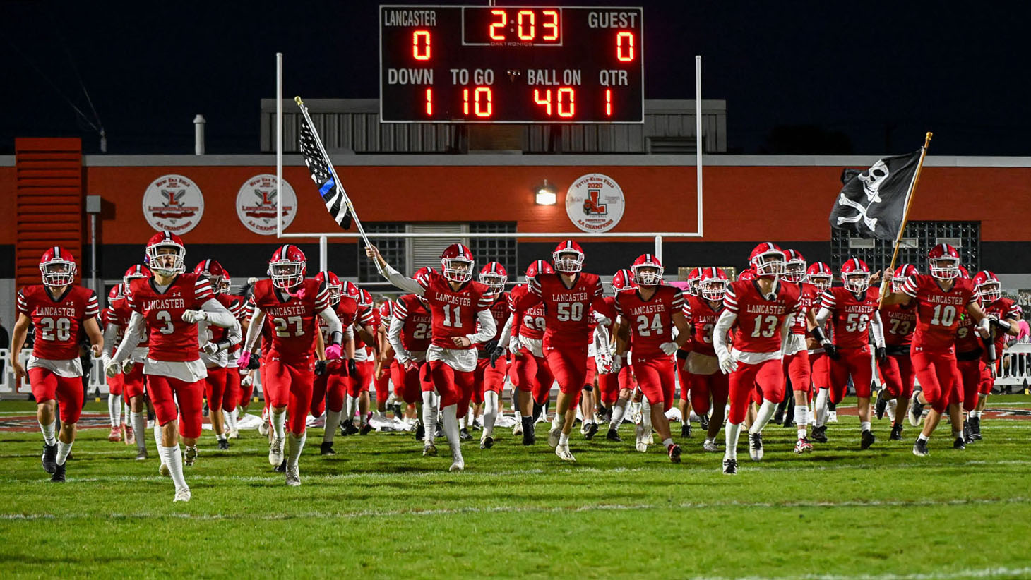 Lancaster Football running onto Foyle/Kling Field