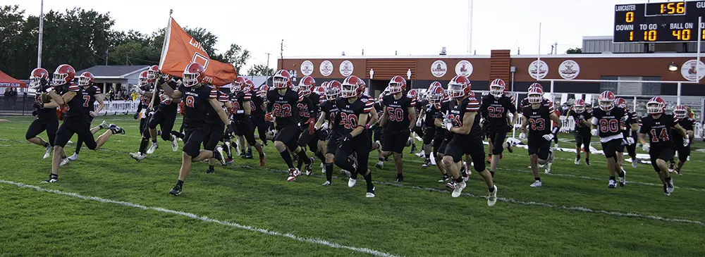 Lancaster Legends running onto the field